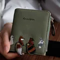 Olive green short leather wallet with cute cartoon animal embroidery and 3D tail charms - Dark Green