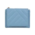 Light blue quilted mini wallet with gold zipper and multi-slot card holder - Blue