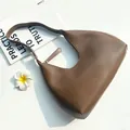 Minimalist dark brown half-moon hobo bag in matte leather for women with shoulder strap - Coffee