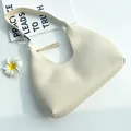 Elegant creamy white faux leather half-moon hobo bag with zipper and integrated strap - Off White