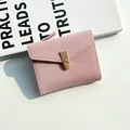 Pink faux leather women's wallet with gold latch lock and litchi texture finish - Pink