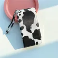 Chic cow print long wallet for women with large capacity and detachable wristlet strap - White