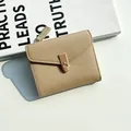 Champagne gold lychee leather wallet with a decorative metal lock and clasp closure - Apricot