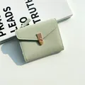 Short mint green lychee textured leather wallet with flap buckle and gold metal clasp - Green