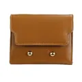 Minimalist brown PU leather tri-fold wallet for women featuring golden stud accents - Brown