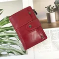 Short wine red faux leather wallet with litchi texture and metal snap button - Red