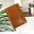 Short bifold faux leather wallet in caramel brown with rivet and zipper detail - Brown