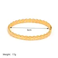 Detailed view of 18K gold plated bangle with overlap ring texture and 6cm diameter - Overlapping Rings Style (JC-250508-1-3)