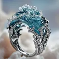 Detail of artistic ocean wave ring featuring blue enamel and sparkling micro-pave crystals - Ring Silver