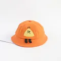 Detail of orange cotton baby bucket hat featuring a 3D yellow cartoon character mascot - Medium / Orange