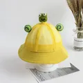 Dettaglio cappello sole giallo per bambini con rete traspirante e decorazioni cartone - Rana Gialla