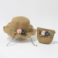 Detail of straw hat and matching handbag set with floral decor and wavy brim - Khaki Sun Hat (Shuanghuacao)