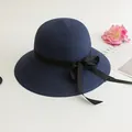 Women's summer straw sun hat in deep blue with a black ribbon bow decoration - Size M (Adult 56-58cm) / Navy Blue
