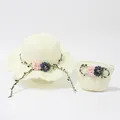 Detail of hand-woven straw sun hat and matching floral bag set with wavy brim - Milky White Sun Hat (Shuanghuacao)