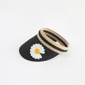 Detail of straw sun visor featuring white daisy embroidery and striped elastic headband - Black Daisy