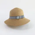 Detailed close-up of handmade woven straw hat with blue white striped ribbon and bow - Khaki - Blue White Ribbon Bow