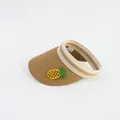 Detail of hand-woven straw sun visor featuring a yellow crochet pineapple patch - Kids Size / Khaki-Pineapple