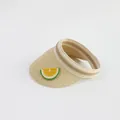 Detailed close-up of straw sun hat featuring a bright lemon patch and striped inner lining - Kids Size / Beige-Lemon