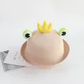 Close-up of kids straw sun hat featuring a cartoon frog design and plush crown detail - 48-52cm / Light Pink