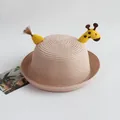 Detail of beige straw hat with cute yellow giraffe embroidery and brown tassel decoration - Giraffe / Pink / One Size