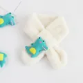 Close-up of cream faux fur kids scarf featuring a cute green crocodile plush toy - Crocodile Cream White
