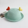 Close-up of mint green straw hat featuring colorful heart accents and fine woven texture - Yellow Orange Heart / Light Green / One Size