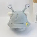 Detailansicht eines Baby-Fischerhutes mit großen Comic-Augen und weißen Plüschohren - Einheitsgröße (52cm) / Blau