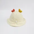 Dettaglio cappello sole neonato con cuori di peluche e coulisse regolabile sotto il mento - 3-24 mesi / Bianco avorio
