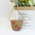 Detail of straw woven crossbody bag with cute cherry appliques and zipper closure - Size S (52cm) / Single Bag / 12x14cm / Khaki