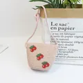 Beige woven straw crossbody bag for kids featuring decorative red cherry patches - Size S (52cm) / Single Bag / 12x14cm / Pink