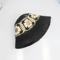 Handmade crochet bucket hat in black with white sunflower pattern for sun protection - M (58cm) / Black