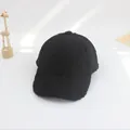 Detailed macro view of black faux shearling baseball cap with warm plush fleece texture - S (49-53cm) / Black