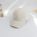 Detailed texture of off-white sherpa baseball cap for kids with warm plush material - S / Milky White