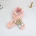 Detail of pink plush kids scarf with cute cartoon bear decoration and cross-over design - Pink