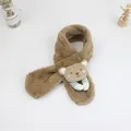 Detail of plush brown baby scarf with a 3D cartoon bear and soft fuzzy texture - Khaki