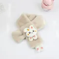 Close-up of soft plush kids scarf featuring cute 3D bunny and carrot embroidery detail - Apricot