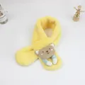 Detailed view of yellow plush baby scarf featuring a cute brown cartoon bear plush ornament - Yellow
