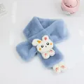 Detail view of plush blue rabbit scarf with white bunny plush toy and carrot pattern - Sky Blue