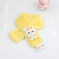 Macro detail of plush yellow kids scarf featuring a 3D bunny ornament and soft carrot embroidery - Yellow