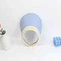 Detail of light blue straw sun visor featuring elegant white pearl embellishments on the brim - Sky Blue