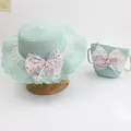 Detail of green kids straw hat and matching bag set with pink mesh bows and pearls - Sequin Mesh Bow - Green