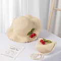 Close-up of summer straw hat and matching bag with red cherry pom-pom decorations - Kids Style (Size S) / Beige