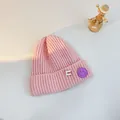 Pink chunky knit beanie for kids with a purple smiley face pin and a rolled cuff - S (48-53cm) / Pink (White Pin)
