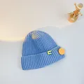 Light blue ribbed knit beanie for children featuring a yellow smiley face pin accessory - S (48-53cm) / Sky Blue (Yellow Pin)
