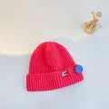 Pink chunky knit beanie for kids featuring a blue safety pin and smiley face badge - S (48-53cm) / Watermelon Red (Blue Pin)