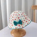 Close-up of floral baby sun hat with dark green bow detail on a wooden display stand - S / Green