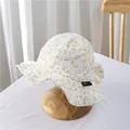 Close-up of floral baby sun hat fabric featuring breathable texture and wave brim detail - S / Light Orange Floral