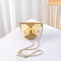 Detail of handmade straw crossbody bag for kids with yellow tulle bow and pom-poms - Natural Wheat - Mesh Pompom Bow