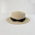 Detail of light beige boater hat with fine straw texture and black grosgrain bow - S (52cm) / Beige