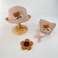 Detail view of pink woven straw sun hat and matching crossbody bag with cute bear patch - Hat And Bag Set / Pink